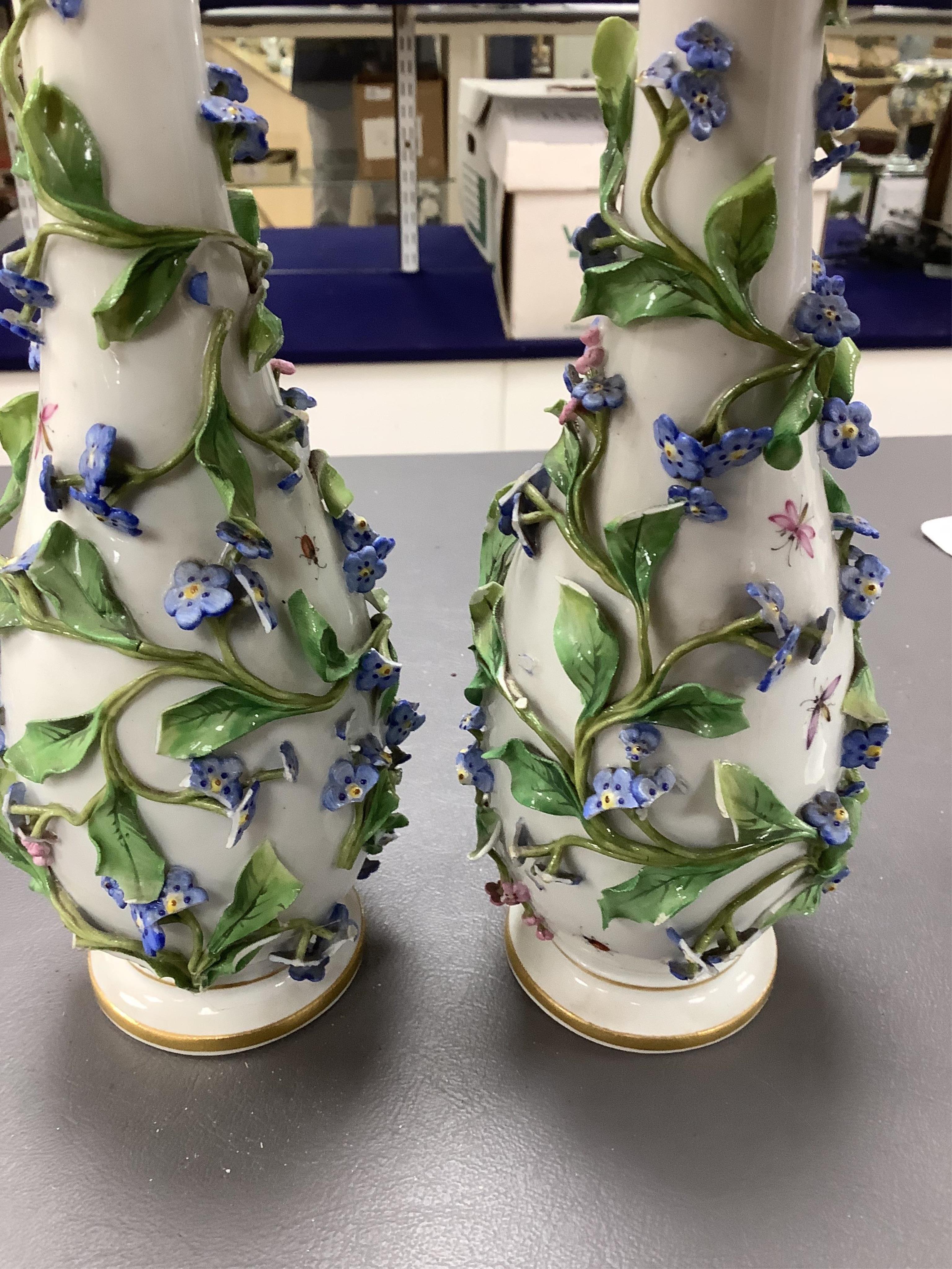 A pair of late 19th century Meissen flower encrusted vases and covers, 20cm high